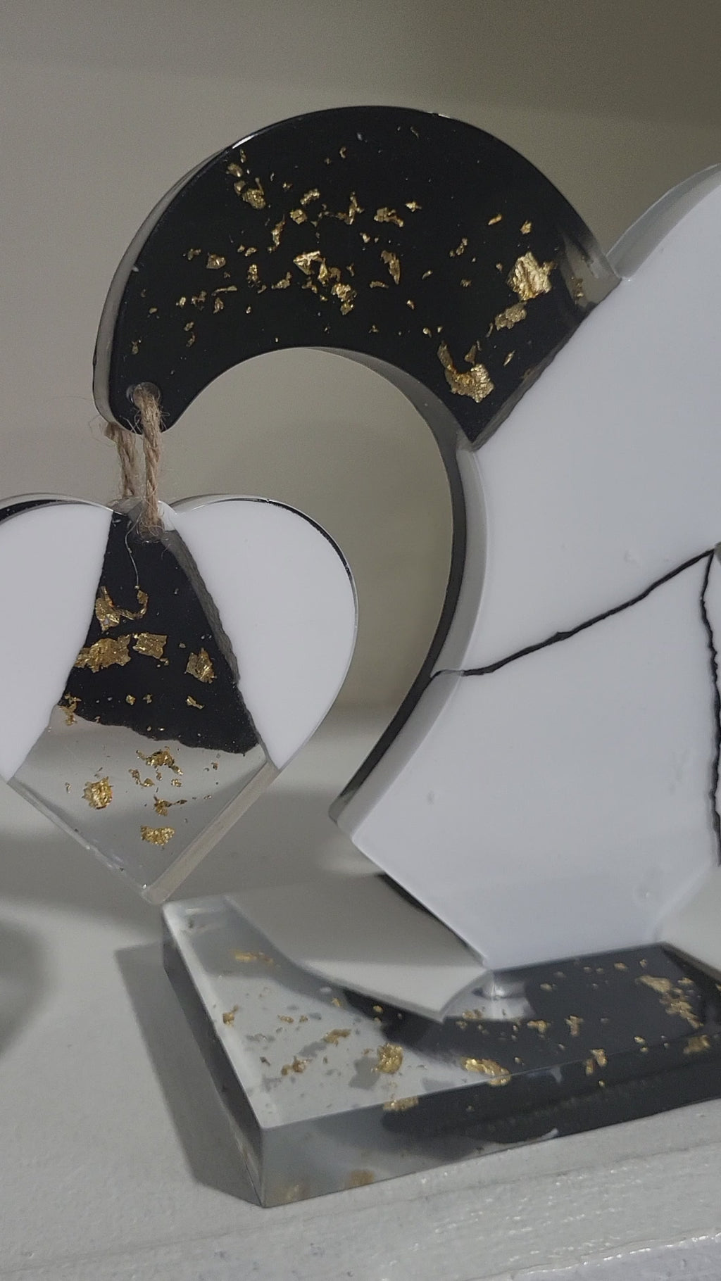 My dangling heart: Black and white with gold flakes