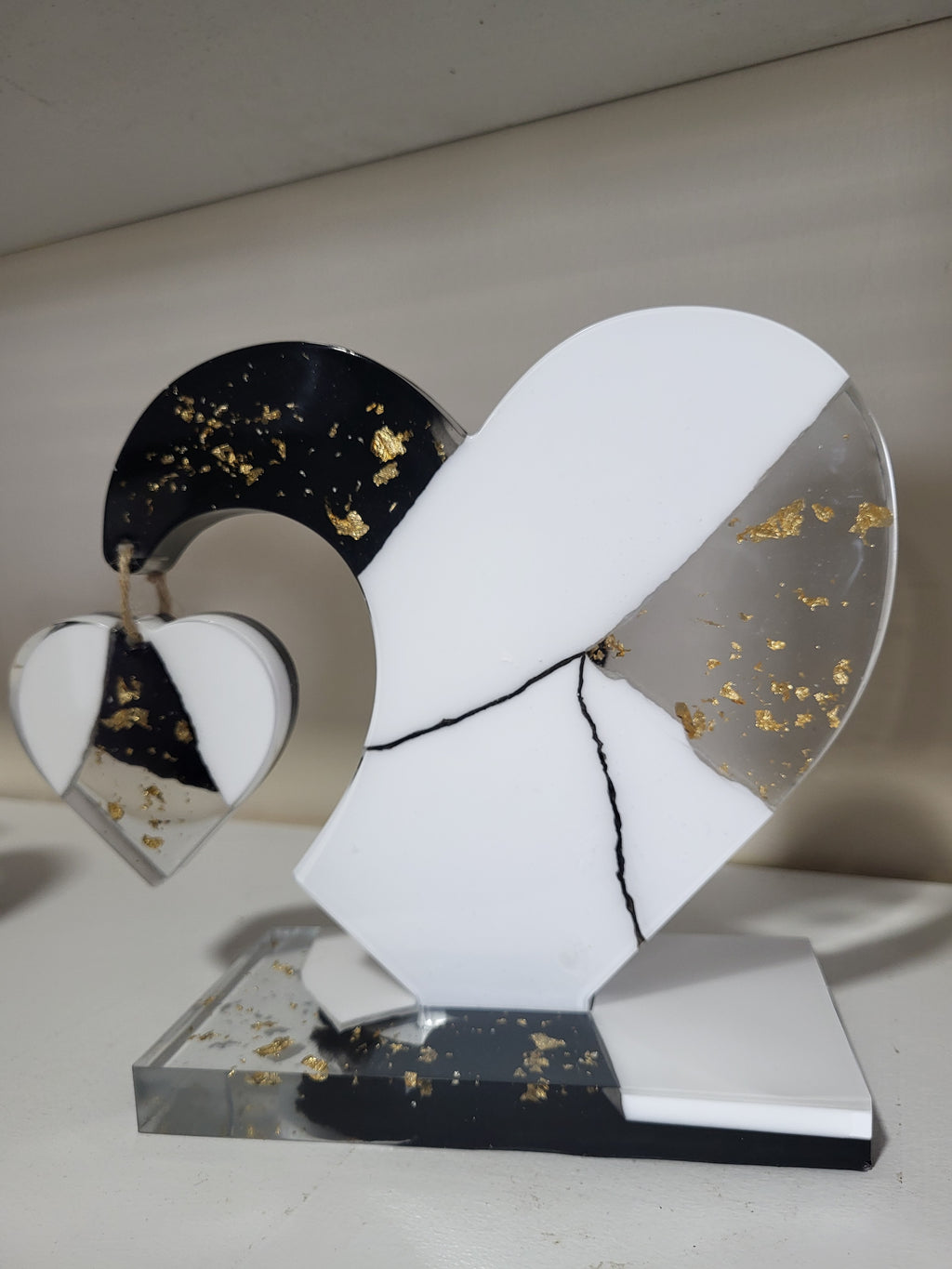 My dangling heart: Black and white with gold flakes
