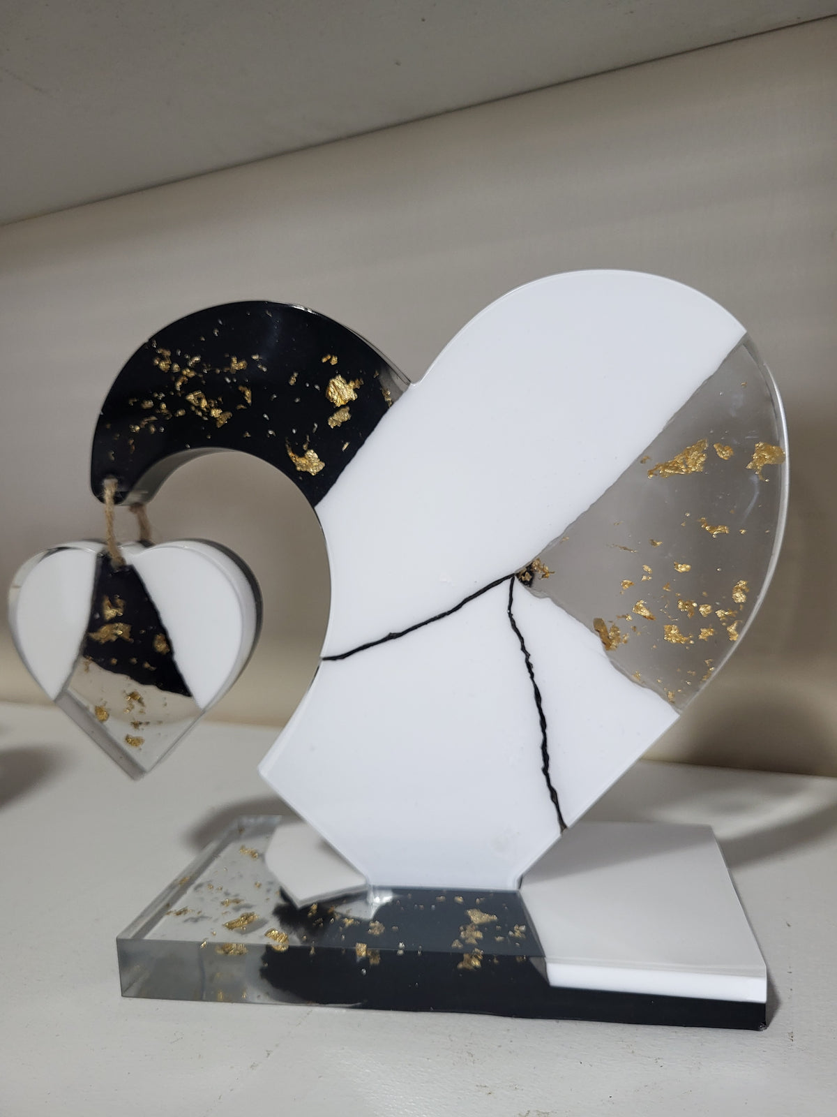 My dangling heart: Black and white with gold flakes
