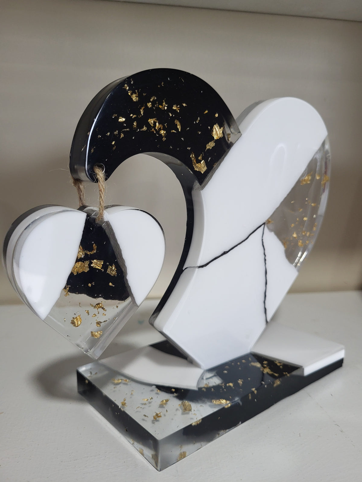 My dangling heart: Black and white with gold flakes