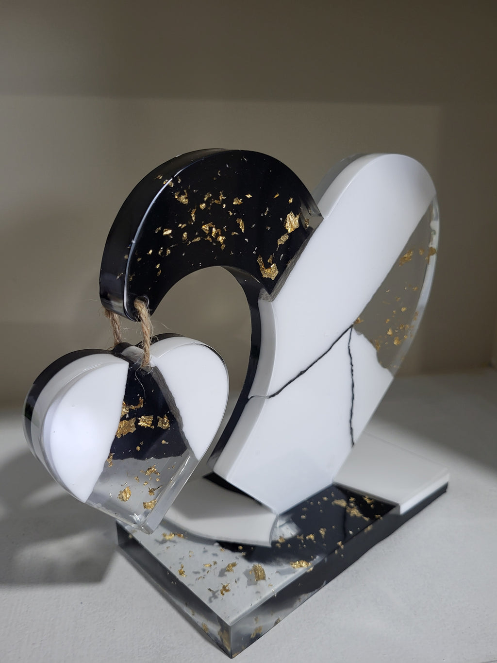 My dangling heart: Black and white with gold flakes