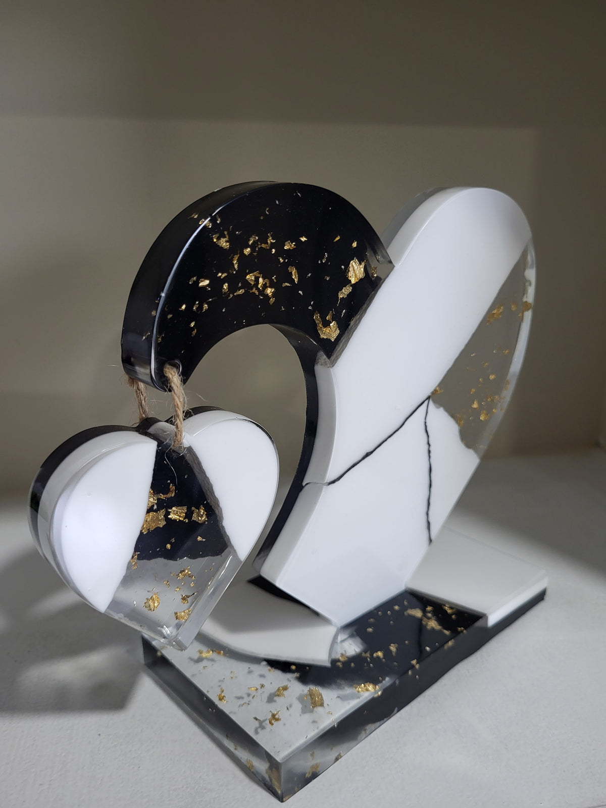 My dangling heart: Black and white with gold flakes